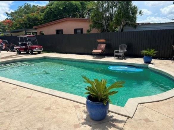 view of pool featuring a patio area