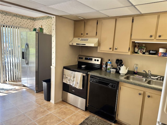 kitchen featuring light tile patterned flooring, appliances with stainless steel finishes, a paneled ceiling, and sink