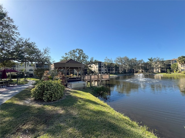 dock area with a gazebo and a water view