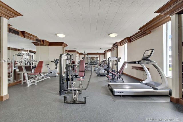 exercise room with ornamental molding