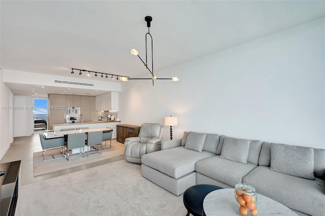 living room with an inviting chandelier