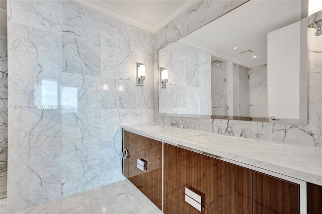 bathroom featuring vanity, ornamental molding, and tile walls