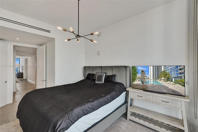 bedroom with an inviting chandelier