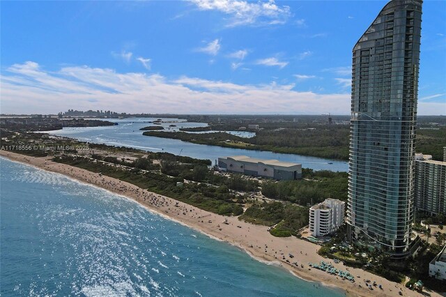 bird's eye view with a water view and a view of the beach