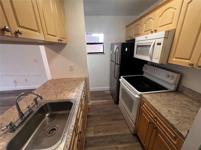 kitchen featuring light brown cabinets, white appliances, dark wood-type flooring, sink, and light stone countertops