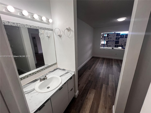 bathroom featuring vanity and hardwood / wood-style flooring