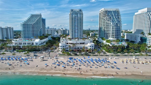 city view featuring a water view and a beach view