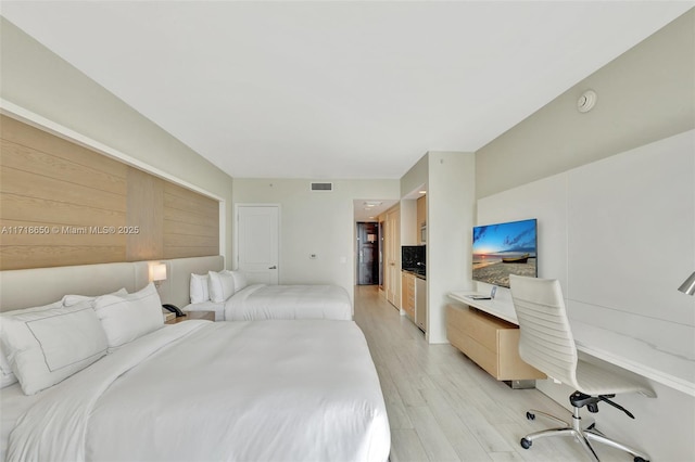 bedroom featuring light wood-type flooring