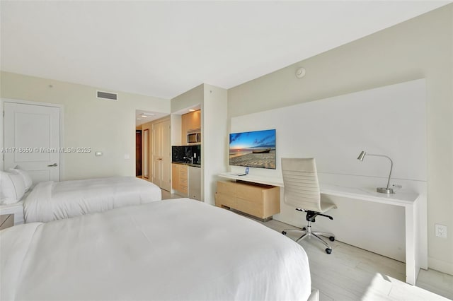 bedroom with light hardwood / wood-style floors