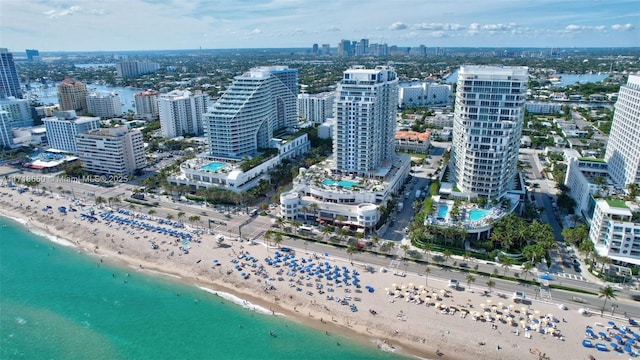 bird's eye view with a beach view and a water view