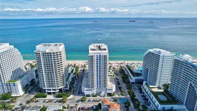 aerial view featuring a water view and a beach view