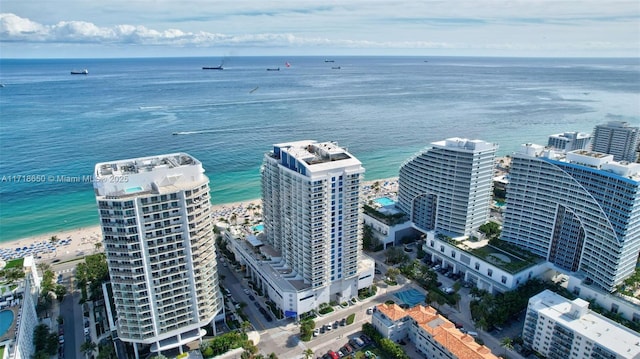 aerial view featuring a view of the beach and a water view