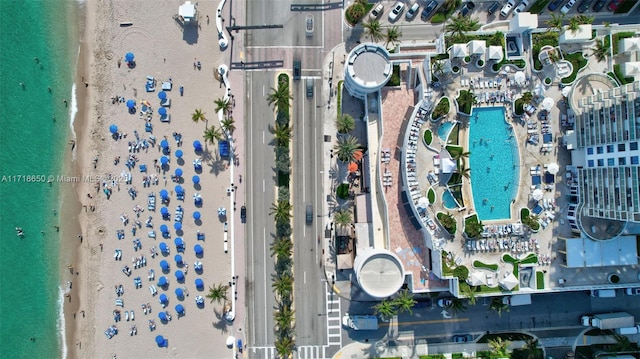 drone / aerial view with a beach view and a water view