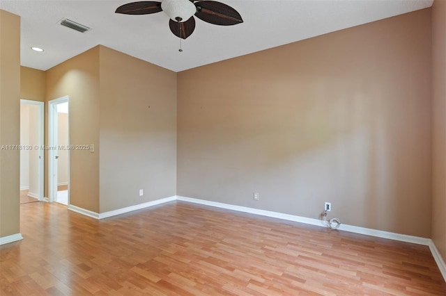 spare room with ceiling fan and light wood-type flooring