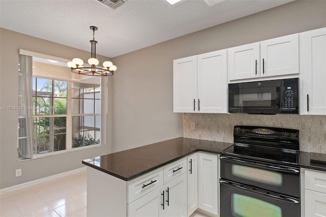 kitchen featuring white cabinets, pendant lighting, a notable chandelier, and black appliances