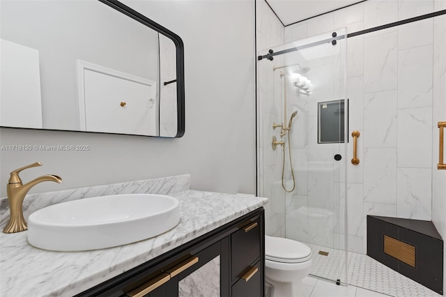 bathroom with tile patterned flooring, toilet, vanity, and walk in shower