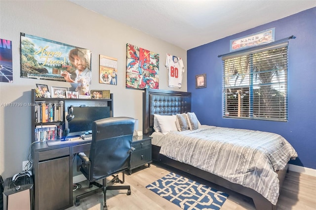 bedroom with light hardwood / wood-style floors