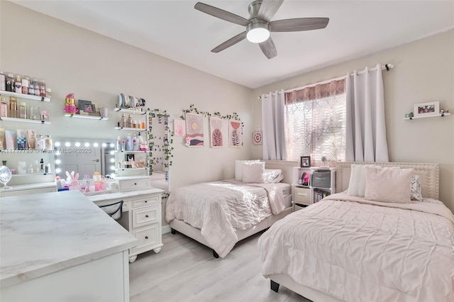 bedroom featuring light hardwood / wood-style flooring and ceiling fan