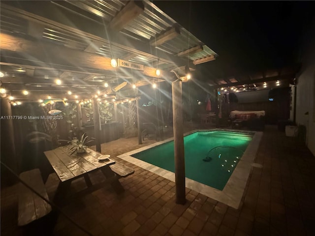 view of swimming pool featuring a patio area