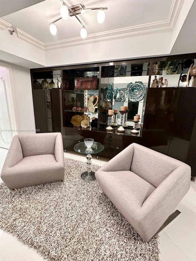 living room featuring rail lighting and ornamental molding