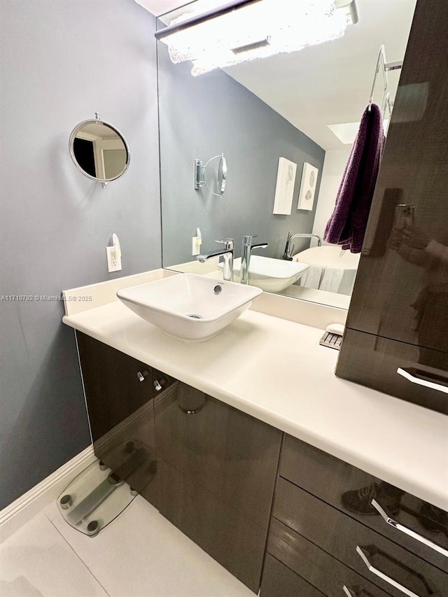 bathroom with tile patterned floors and vanity