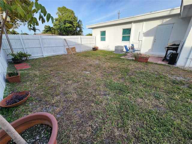 view of yard with central air condition unit