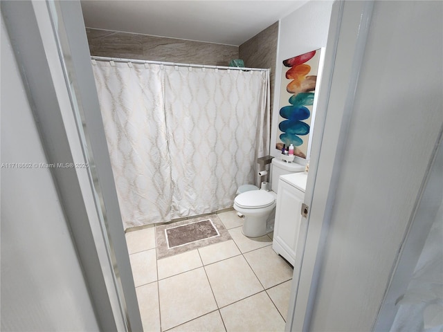 bathroom featuring tile patterned flooring, vanity, a shower with shower curtain, and toilet