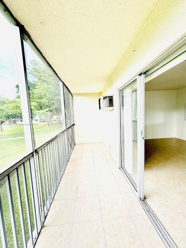 balcony featuring an AC wall unit