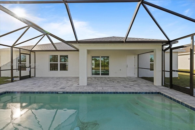 view of swimming pool featuring a lanai and a patio