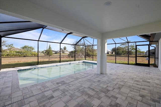 view of pool with a lanai and a patio