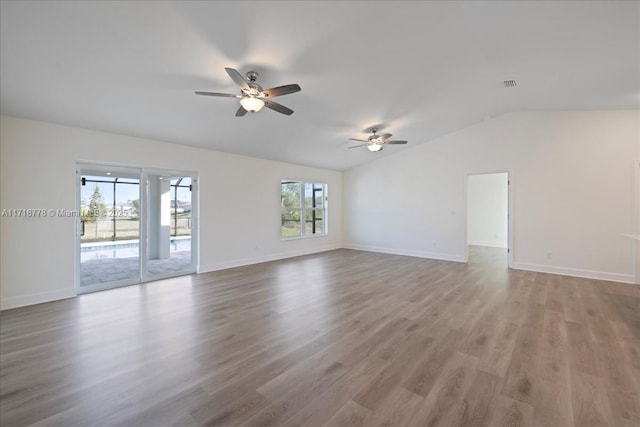 unfurnished room featuring ceiling fan, light hardwood / wood-style flooring, and vaulted ceiling