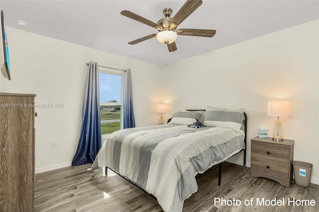 bedroom with ceiling fan and hardwood / wood-style floors