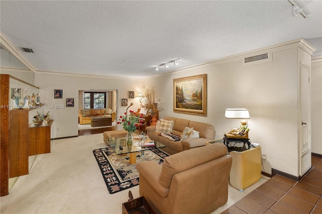 living room with carpet floors, crown molding, rail lighting, and a textured ceiling