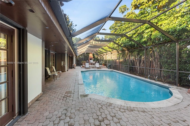 view of pool featuring a patio area and a lanai