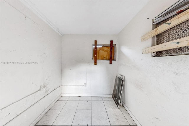 unfurnished room featuring light tile patterned flooring