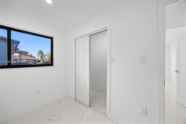 unfurnished bedroom featuring a closet