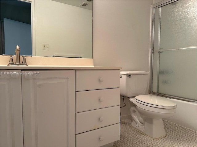 full bathroom featuring tile patterned floors, vanity, enclosed tub / shower combo, and toilet