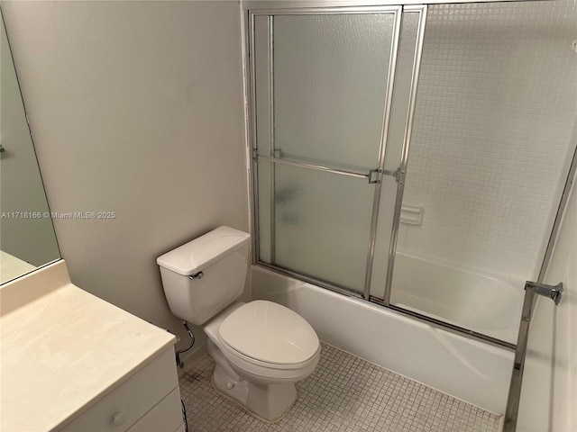 full bathroom featuring tile patterned flooring, vanity, enclosed tub / shower combo, and toilet