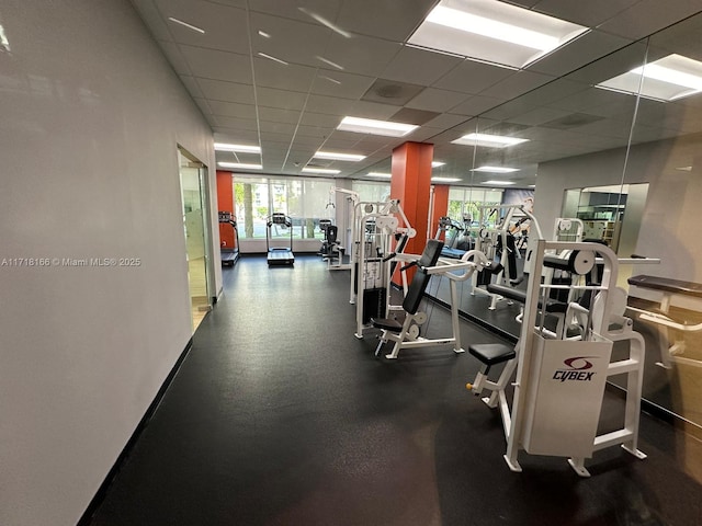 exercise room featuring a drop ceiling