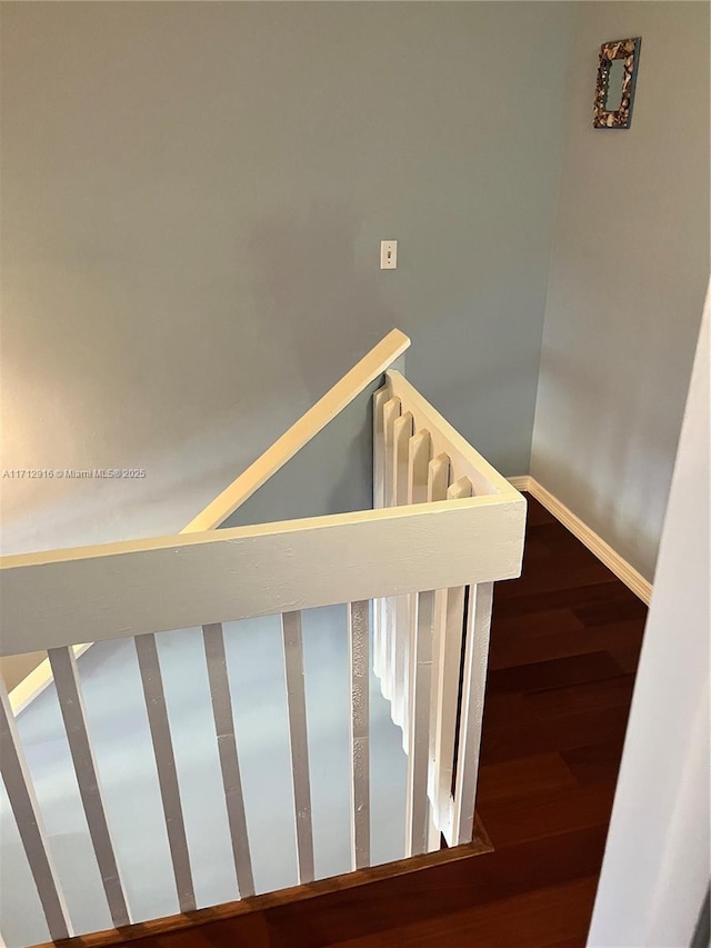 stairs with hardwood / wood-style floors