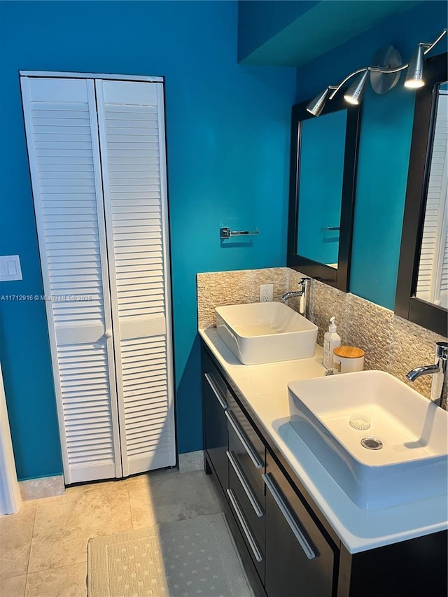 bathroom featuring tile patterned flooring and vanity