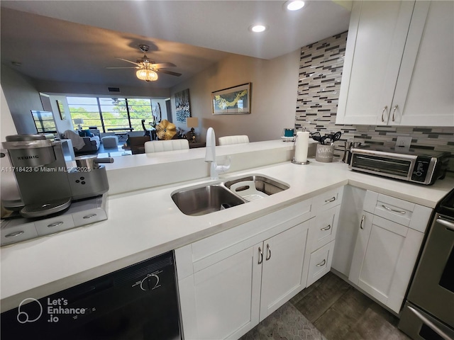 kitchen featuring dishwasher, white cabinets, kitchen peninsula, and sink