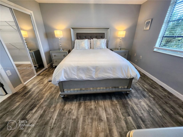 bedroom featuring a closet and dark hardwood / wood-style floors