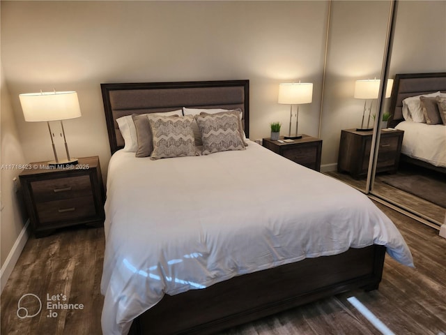 bedroom featuring dark hardwood / wood-style flooring