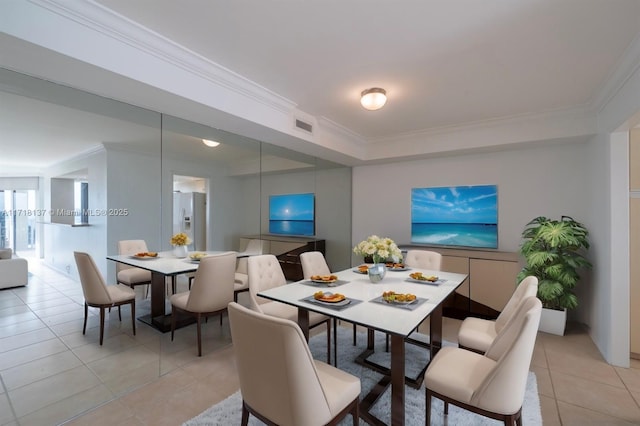 tiled dining room with ornamental molding