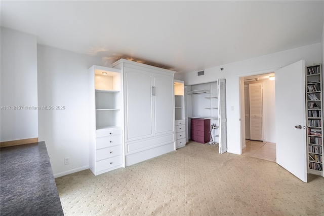 unfurnished bedroom with light carpet