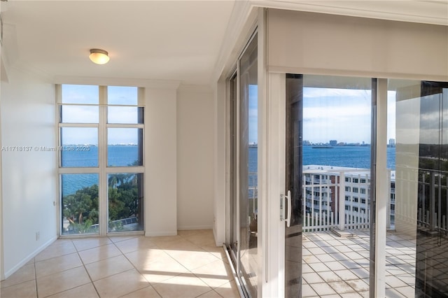 4000 Towerside Ter Unit 908, Miami, FL 33138 - spare room with a water view, crown molding, plenty of natural light, and light tile patterned floors