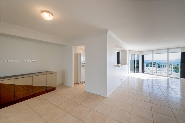 4000 Towerside Ter Unit 908, Miami, FL 33138 - spare room with crown molding, tile patterned floors, and a wall of windows