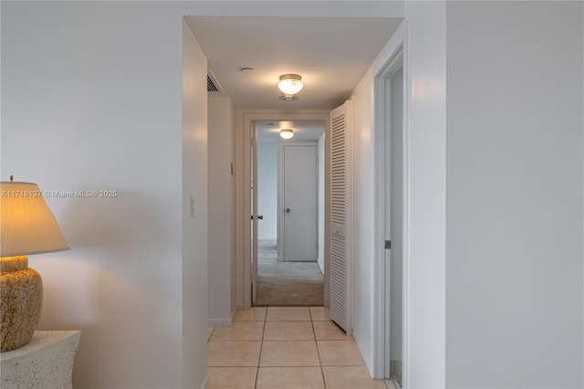 4000 Towerside Ter Unit 908, Miami, FL 33138 - hall featuring light tile patterned floors and light colored carpet