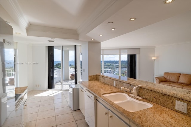 4000 Towerside Ter Unit 908, Miami, FL 33138 - kitchen featuring crown molding, white appliances, recessed lighting, white cabinetry, and light tile patterned floors